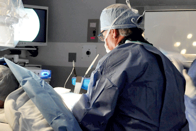 a doctor performing decompression pars defect surgery