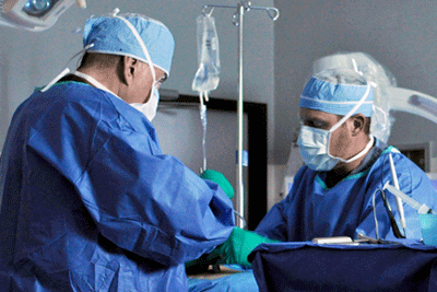 spinal surgeons performing a laminotomy